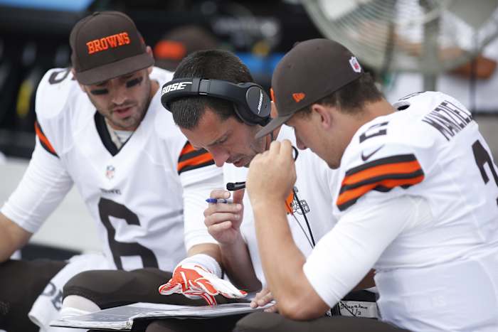 Sep 7, 2014; Pittsburgh, PA, USA; Cleveland Browns offensive coordinator Kyle Shanahan (center) talks with Browns quarterbacks Brian Hoyer (6) and Johnny Manziel (2) against the Pittsburgh Steelers during the fourth quarter at Heinz Field. The Steelers won 30-27. Mandatory Credit: Charles LeClaire-USA TODAY Sports